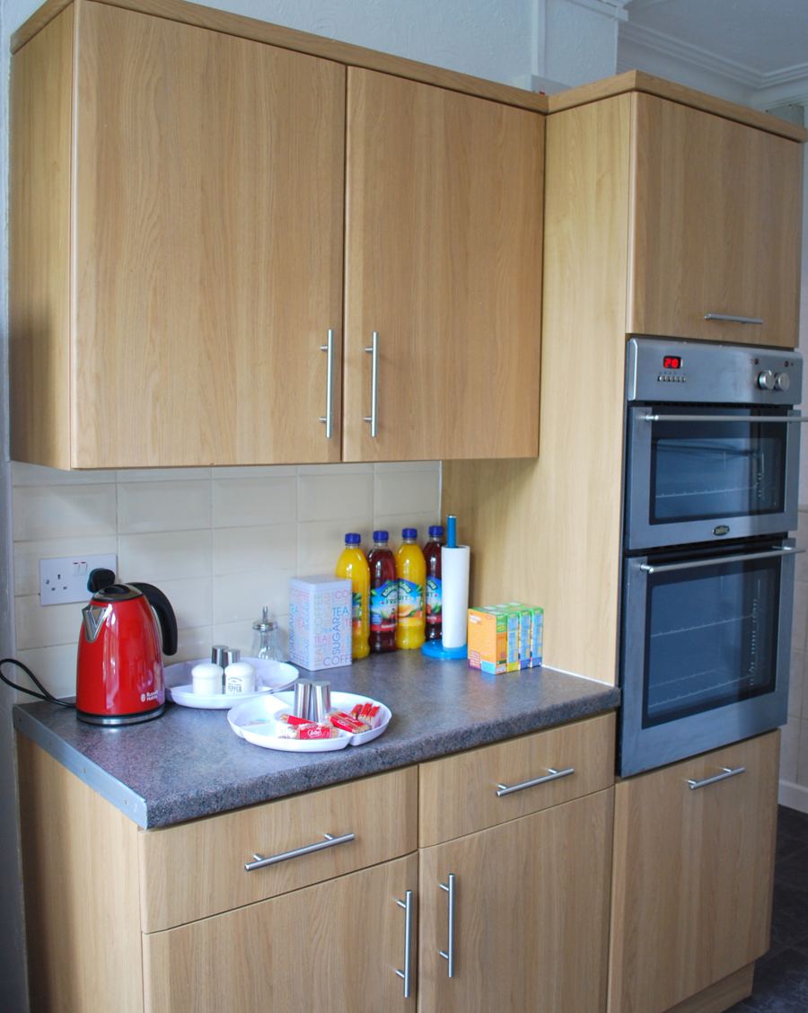 One of the two guest kitchens, with oven, kettle and tea things on the worktop